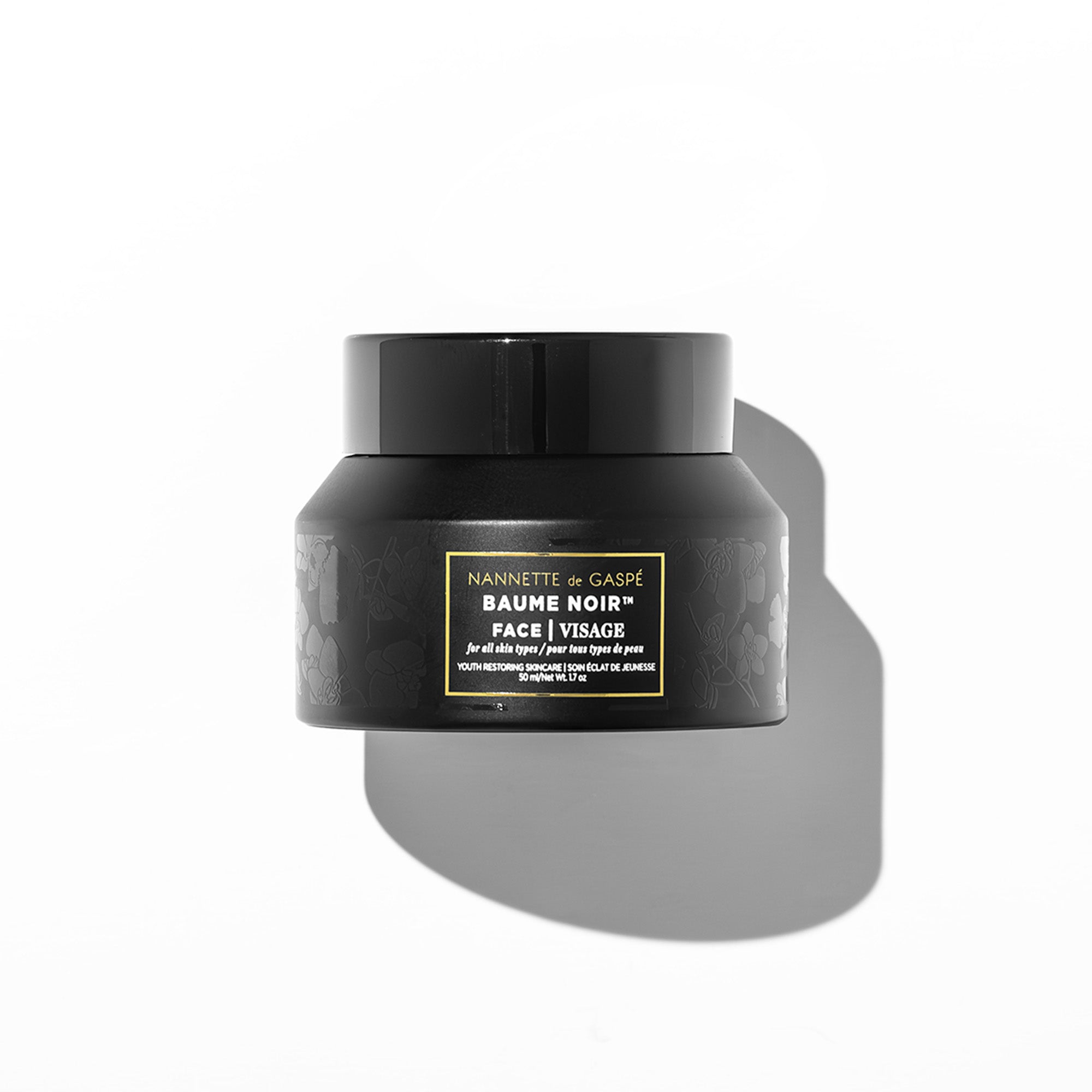 NANNETTE de GASPÉ Baume Noir Face luxury firming, hydrating, brightening face cream in black jar, 50 mL