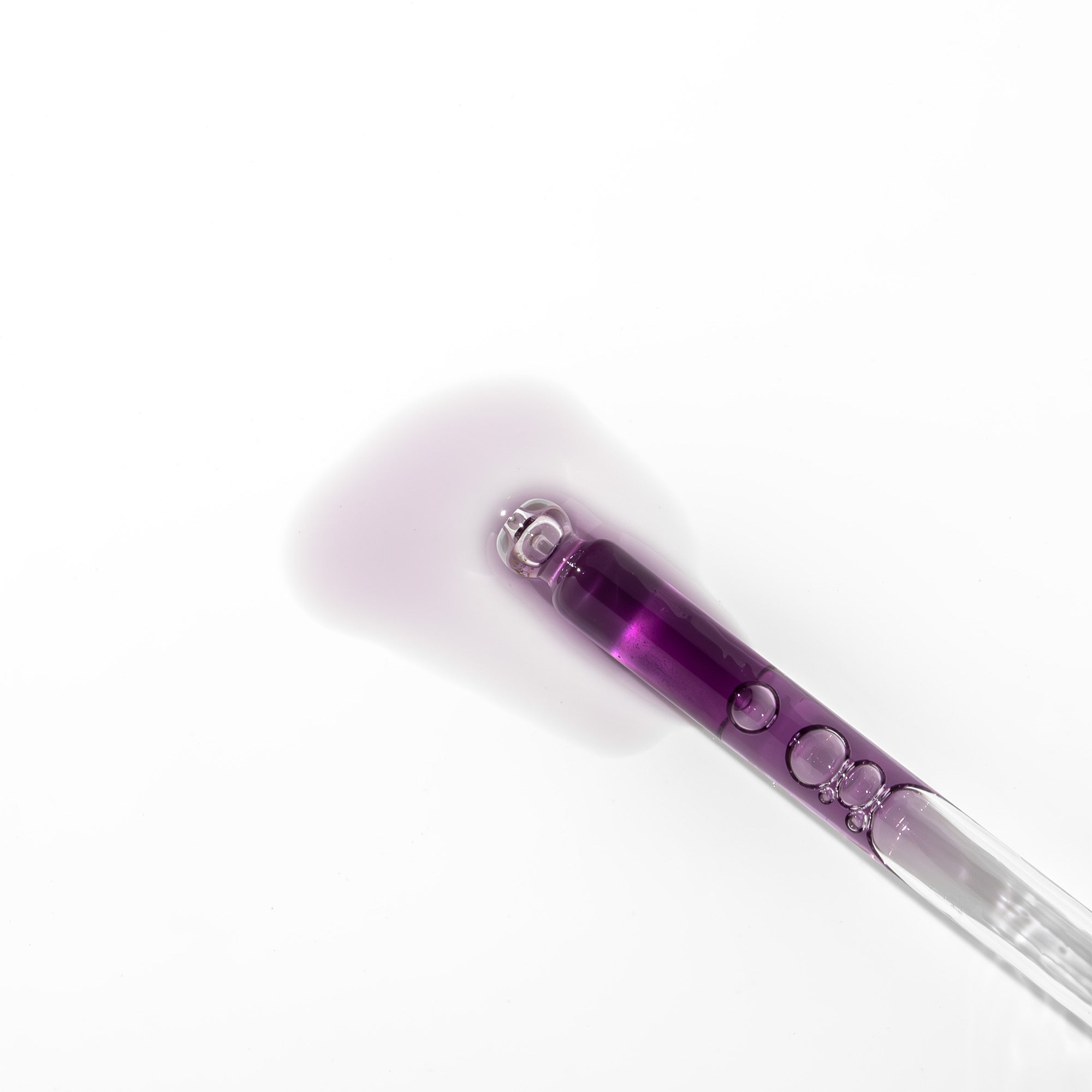 Close-up of Elixir Noir Face Oil texture—silky, fast-absorbing oil that smooths and nourishes skin