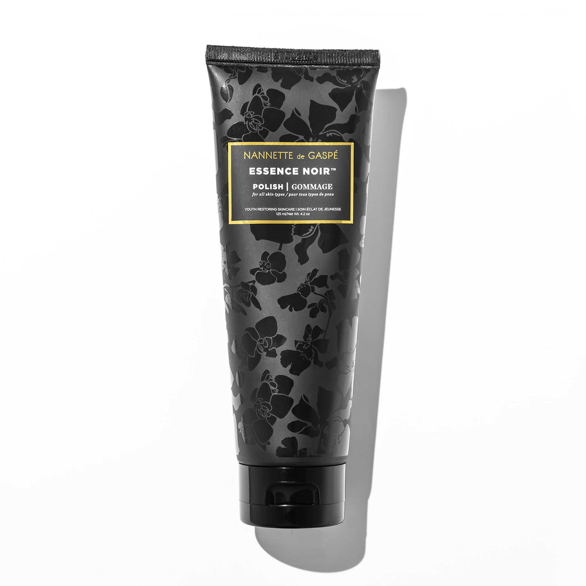 NANNETTE de GASPÉ Essence Noir Polish triple-action facial exfoliator in black tube, 125 mL