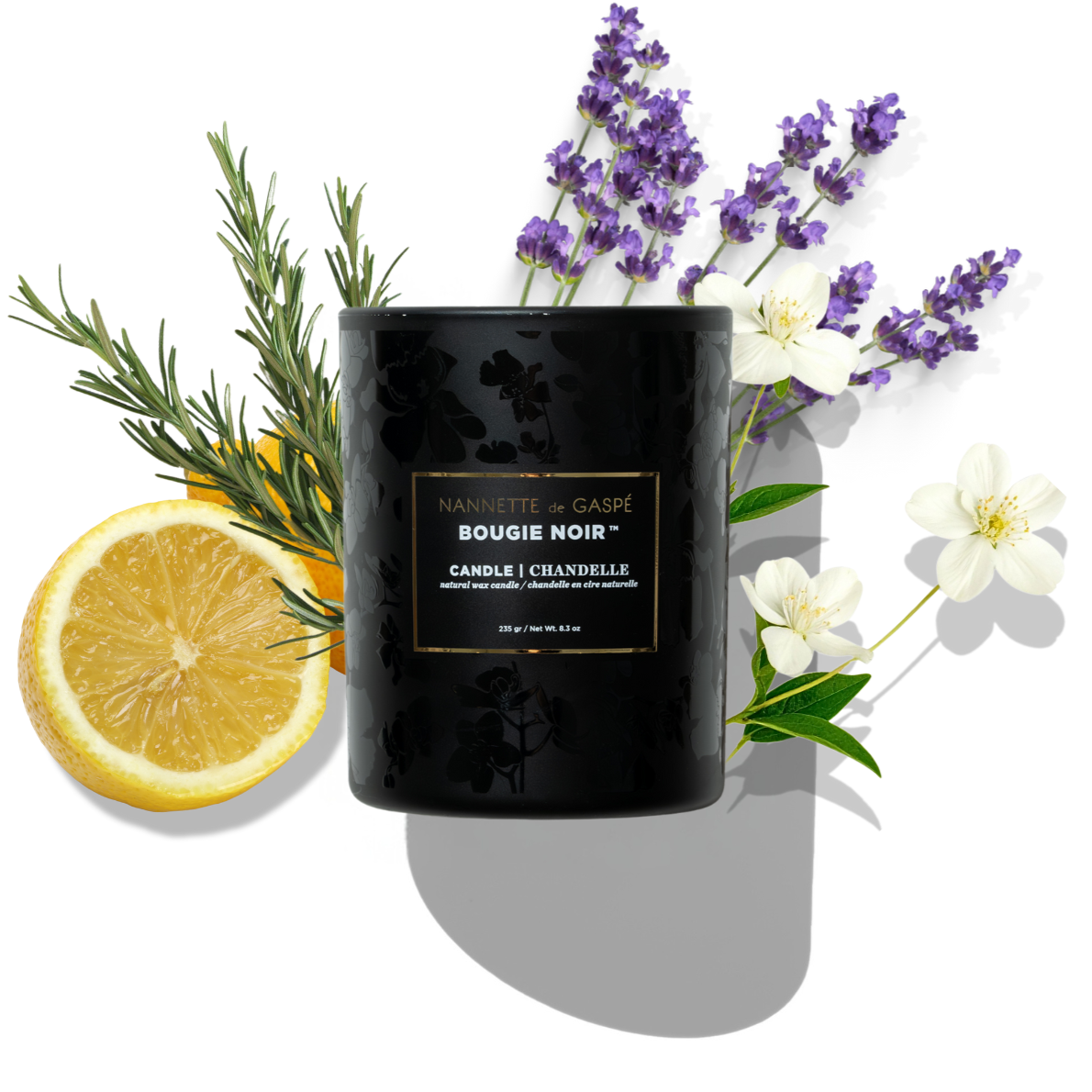 Black candle labeled 'Bougie Noir' with lemon, lavender, and rosemary on a white background